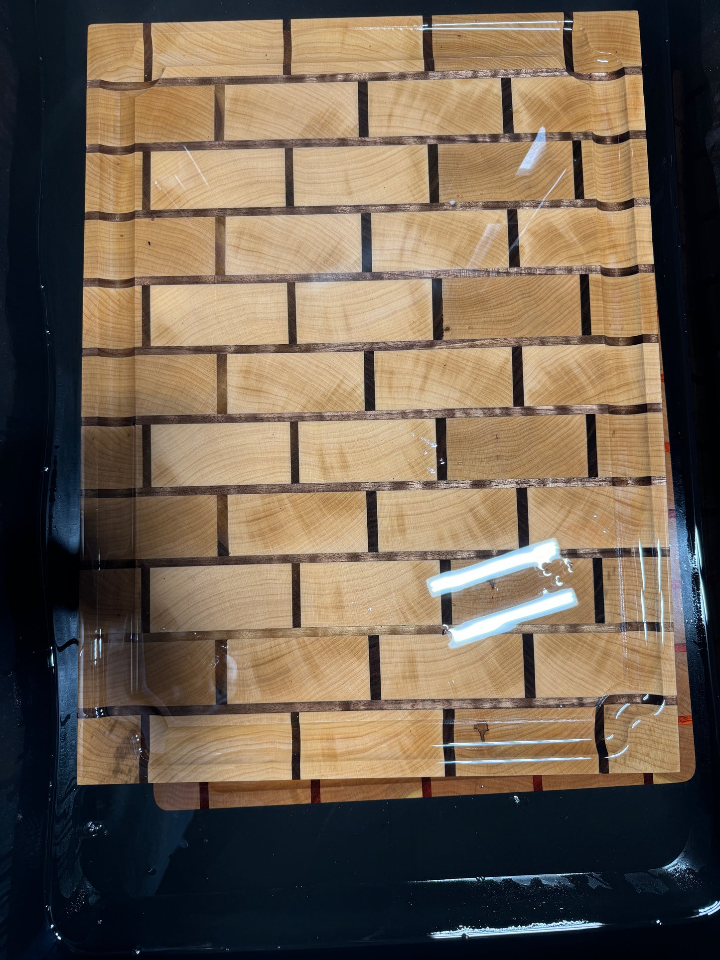 Maple and walnut end grain cutting board